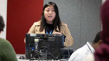 A PhD student presenting.