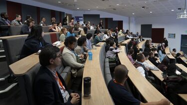 A lecture theatre full of academics and doctoral researchers.