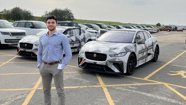 Student stood in front of cars ar JLR