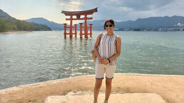 Student stood in front of a lake