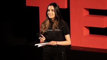 Maria hosting the TEDx event.