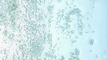 Lots of small bubbles on a light blue background.