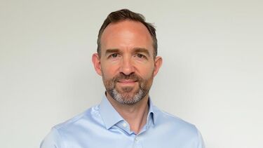 Jim Brown - a white man with brown hair in a blue shirt