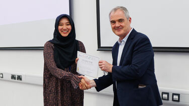 Student being awarded a certificate