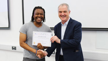 Student being awarded a certificate