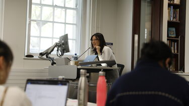 Graduate presenting to classroom