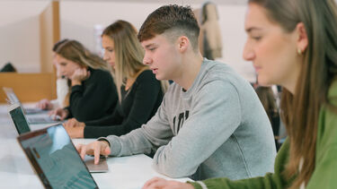 Students working on laptops