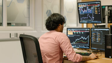 A student using trading room software in the Management School