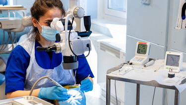 Dental student working on a simulated model