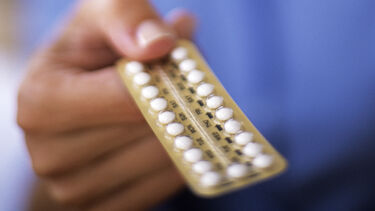 hand holding a contraception packet