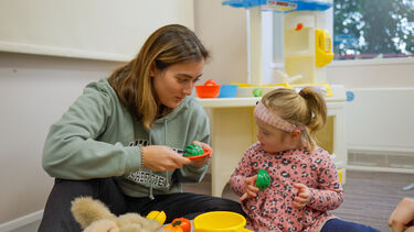 Speech and Language Therapist playing with a young girl