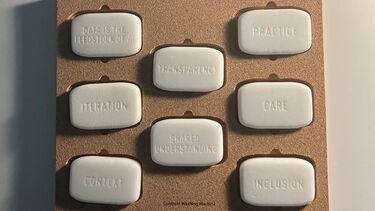 The Constant Washing Machine artwork with the certificate for the impact award above it.