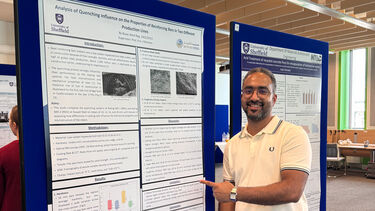 MMet Student Naser in front of his poster presentation