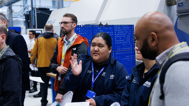People talking together on shop floor