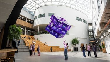 Girl with hovering cube illustrating study at Sheffield