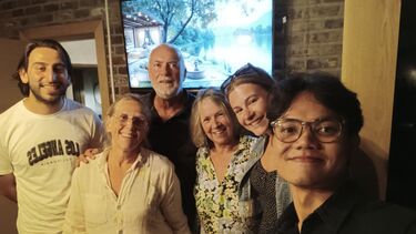 A Mixed group of 6 people, young and a little older all smiling