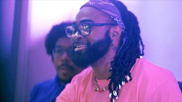 Student Dan in purple hue