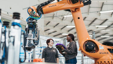Image shows two University of Sheffield engineers in a manufacturing facility