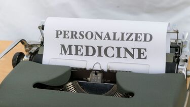 Type writer with a page entitled personalised medicine