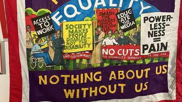 An image of a banner used by members of the disabled people's movement in the UK reading 'Disabled People Fightback - Nothing about us without us'. Exhibited at the https://phm.org.uk/exhibitions/nothing-about-us-without-us/. Photo by D.Goodley, October 2023