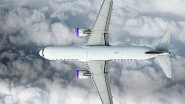 Image shows a top down view of an aeroplane in a cloudy sky. 