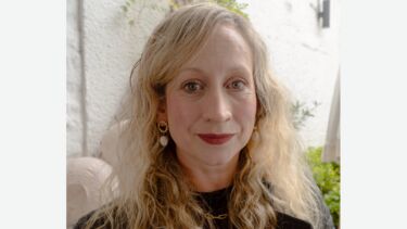 Headshot of Jess Bradley, stood outside 