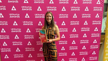 Women standing with award at UKStartup awards 
