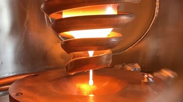 Molten drop of metal entering an atomiser
