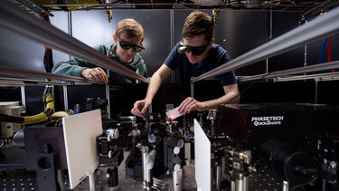 Two students in the ultrafast laser spectroscopy lab