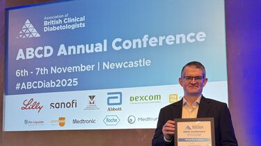 A person holding a certificate.