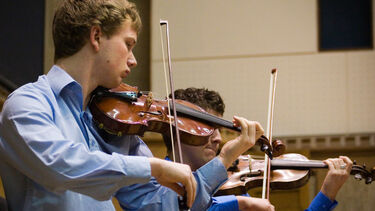 A Music student playing an instrument