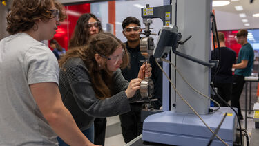 Some engineering students working in the structures lab
