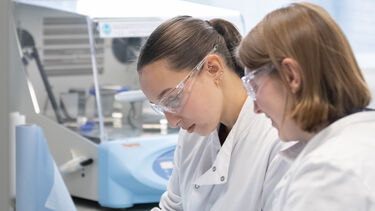 Two people in a research lab.