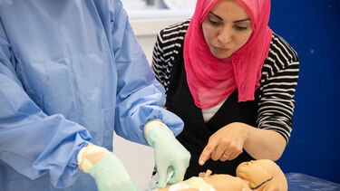 ACP students working on neonatal model