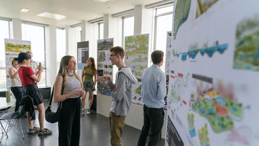 Students and staff looking around landscape architecture work