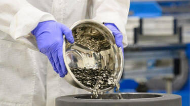 swarf being poured into a graphite mould