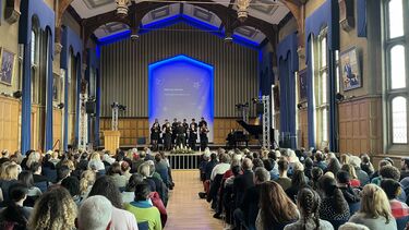 Firth Hall is packed for the 2025 University Carol Service