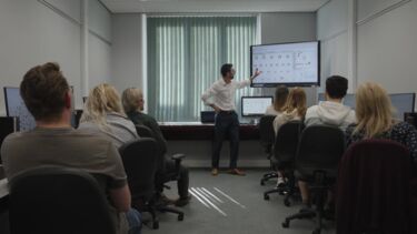 Photo of Dr Adam Hodgson teaching students in the Julia Garnham Centre