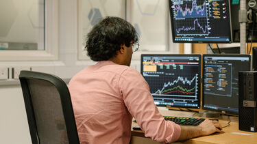 Student using the trading room in the Management School 