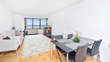 living room with sofa and dining table and chairs 