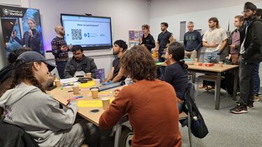 Groups of students talking in start-up studio