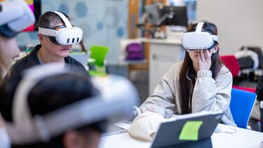 Two students in VR headsets