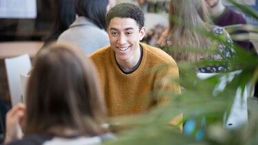 Students talking in a study space.