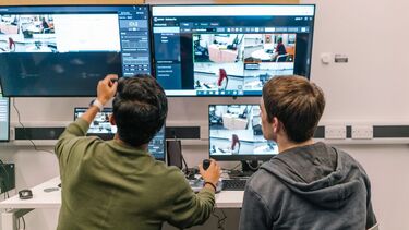 Two students looking at computer screens