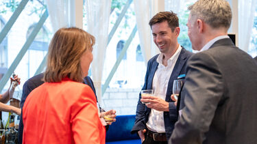 Alumni chatting at an alumni reception