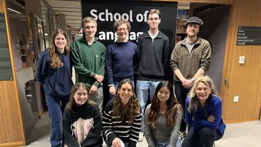 Group shot of language coaches, two rows of people