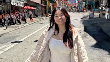 Young woman on a street with lanterns