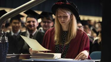 Steward checking certificates at desk