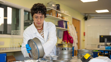 Students soil sieving. 