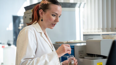 Student using a laser particle size analysis machine. 